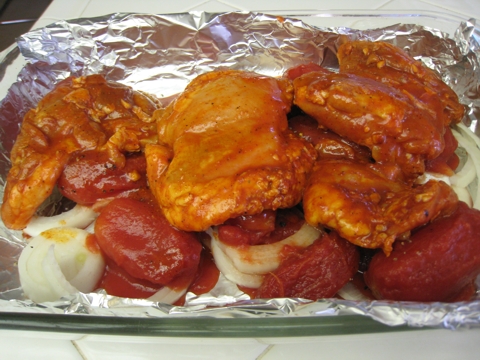 lay chicken on tomatoes